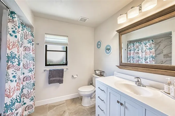 Full bath featuring vanity,