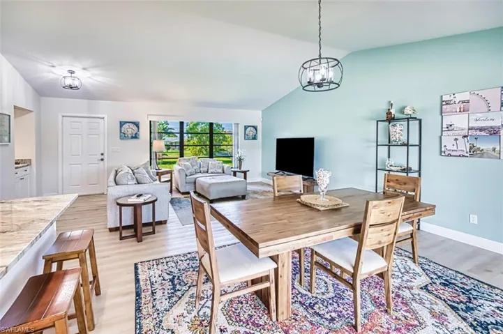 Dining room with vaulted ceiling.