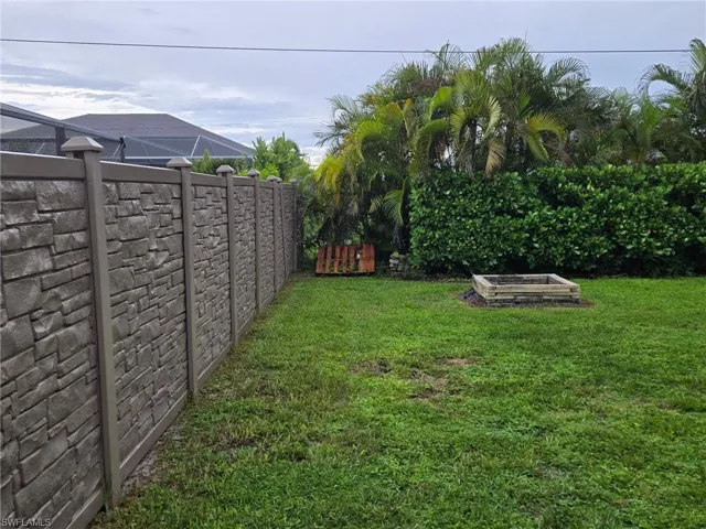 View of yard with a vegetable garden