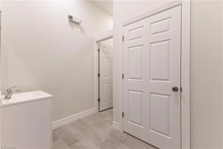 Bathroom with vanity and light tile patterned floors