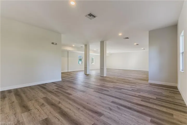 Unfurnished room with recessed lighting and light wood-type flooring