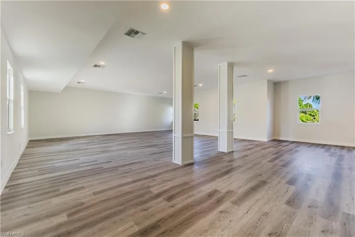 Unfurnished room featuring light wood-type flooring and recessed lighting