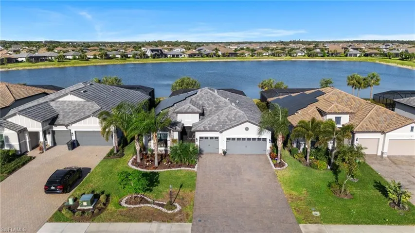 Drone / aerial view featuring a residential view and a water view