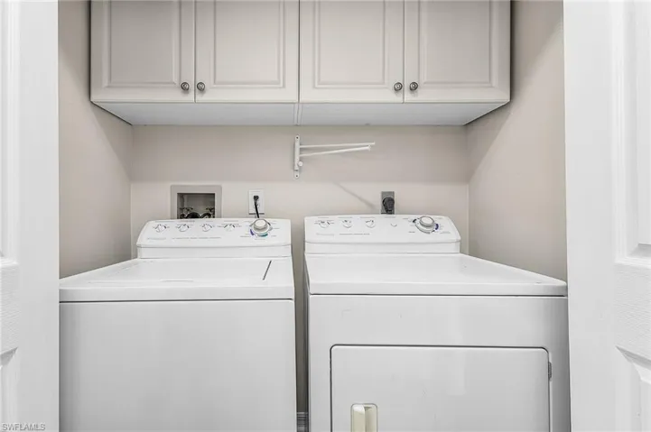Laundry in residence w/extra cabinet storage