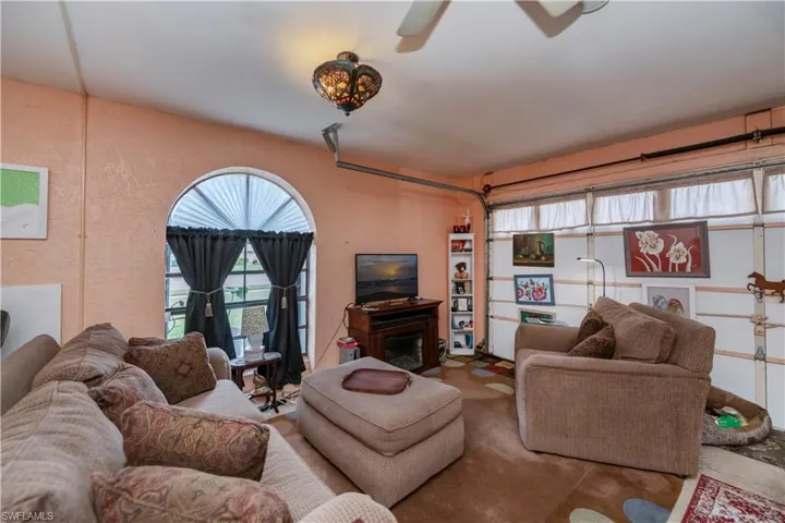 Living room featuring ceiling fan