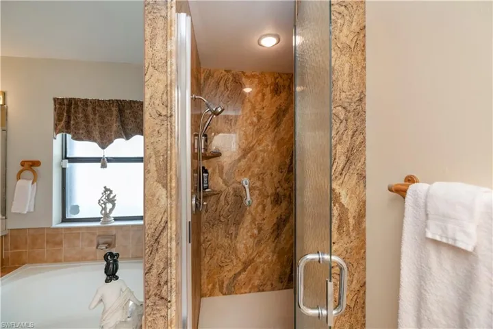 Bathroom featuring independent shower and bath