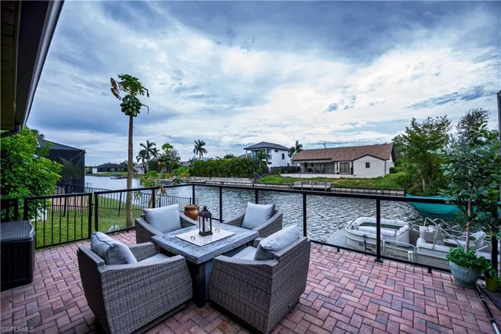 View of patio / terrace with outdoor lounge area and a water view