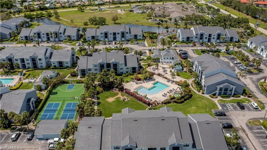 Community featuring multiple residential buildings, two swimming pools, two tennis courts, and a basketball court