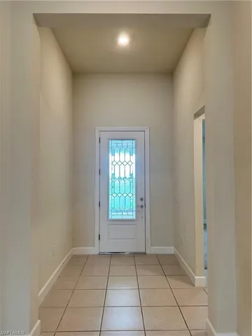 Foyer featuring light tile patterned flooring