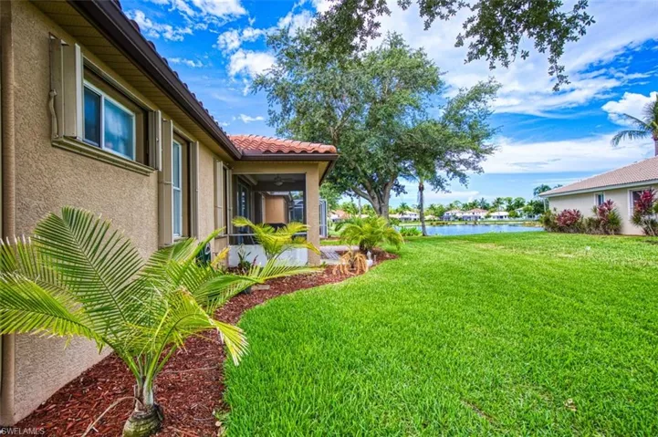 View of yard with a water view