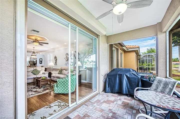 Sunroom / solarium featuring plenty of natural light and ceiling fan