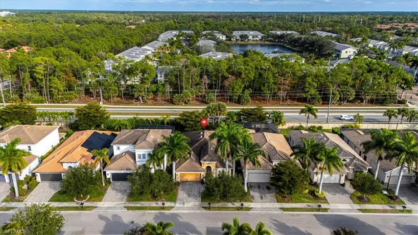 Aerial perspective of suburban area with a heavily wooded area