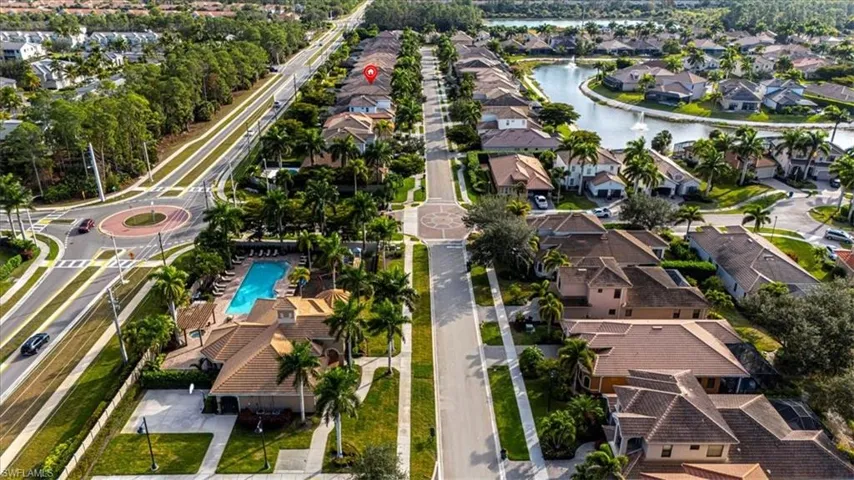 Aerial overview of property's location with nearby suburban area and a large body of water