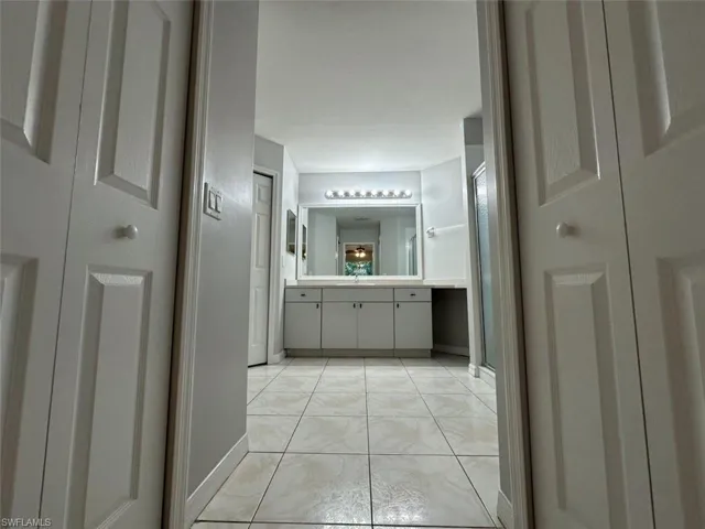 Bathroom with vanity and a shower stall