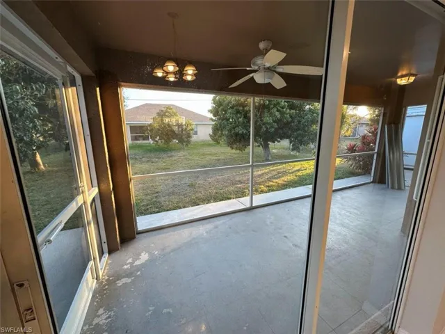 Unfurnished sunroom with a chandelier and plenty of natural light