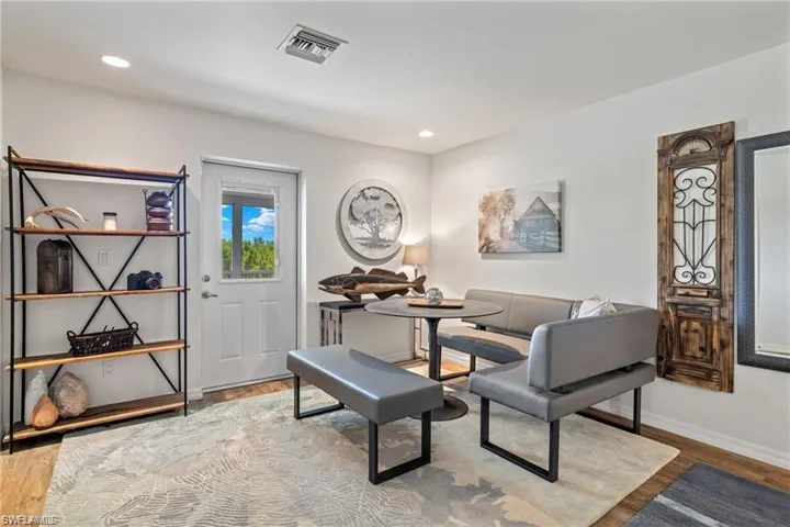 Living area featuring wood-type flooring