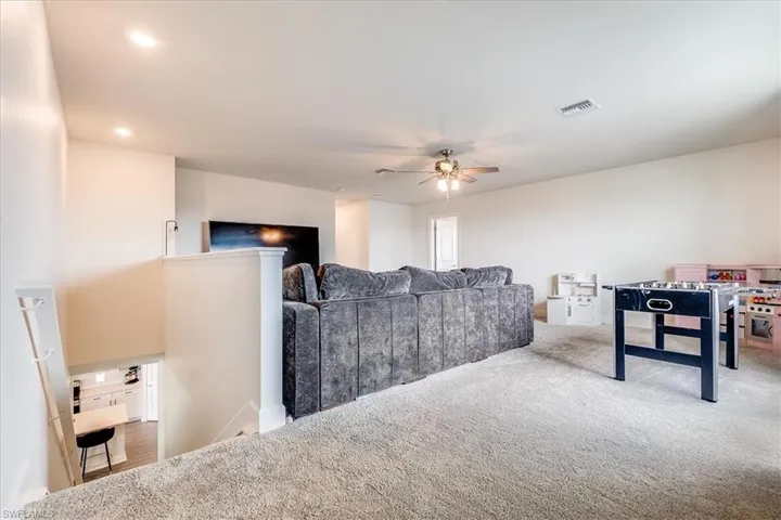 Carpeted Loft area perfect for a second living space, playroom or media concept