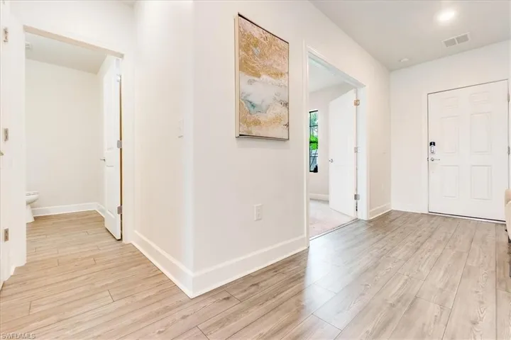 Foyer featuring light wood-vinyl flooring throught 1st floor main areas