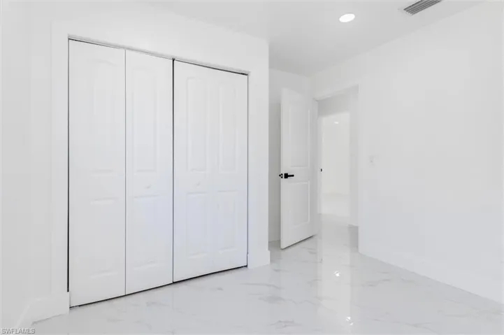Unfurnished bedroom with a closet