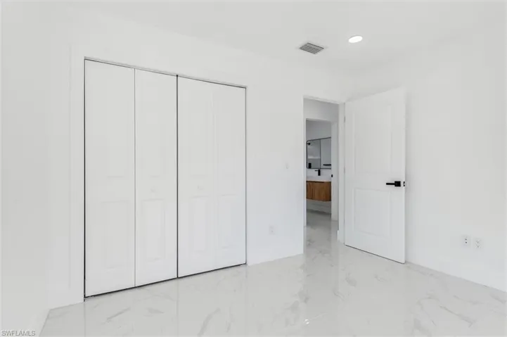 Unfurnished bedroom featuring a closet