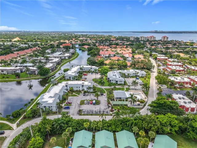Aerial view of property's location featuring a nearby body of water