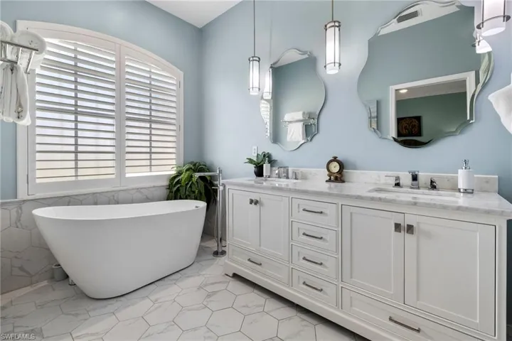 New soaking tub, dual vanity lighting and fixtures complementing the home hues, quality and functionality.