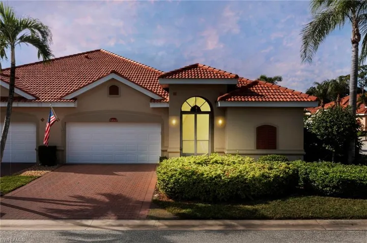 Villa with 2 car garage, corner lot outside view.