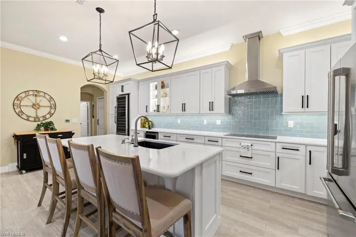 Completely remodeled kitchen with the latest in color hues, fixtures, upscale appliances, wood cabinets, countertop island & ceramic tile.