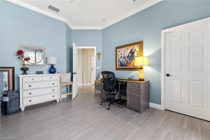 Spacious flex room used as a home office and for overflow guests. Walk in closet a plus, and just steps from guest bath.