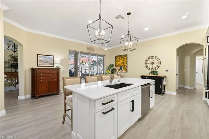 Upscale kitchen newly renovated, spacious family and entertainment center looking onto courtyard.