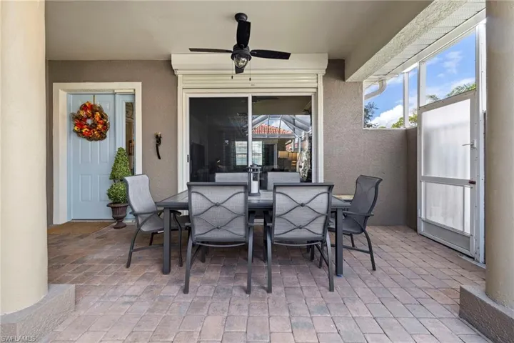 Covered seating area just outside kitchen/great room. New fixtures, painted, color scheme complementary throughout.