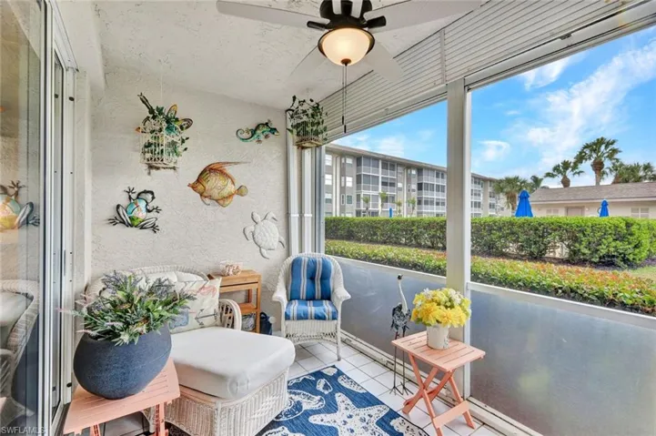 Sunroom featuring a ceiling fan