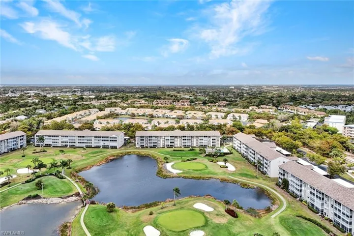 Bird's eye view of a golf course and a large body of water