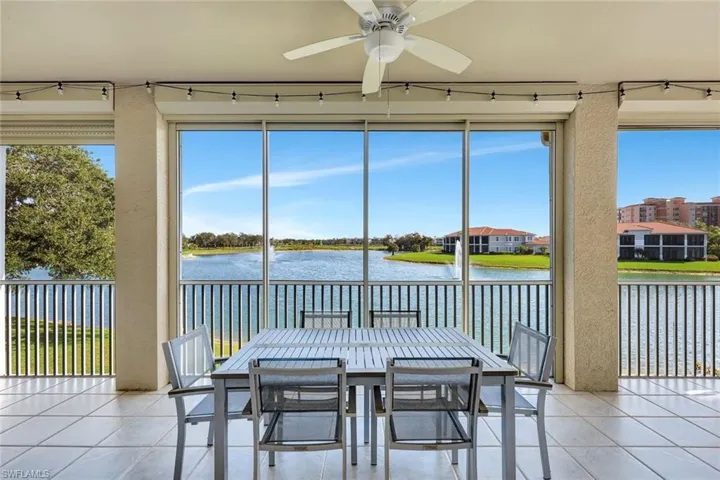 Sunroom / solarium featuring a water view
