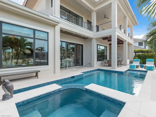 View of pool featuring an in ground hot tub, a patio, and ceiling fan