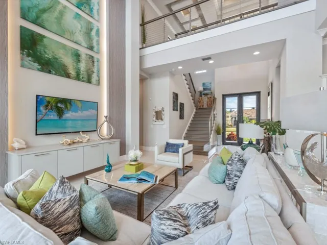 Living room featuring a high ceiling and french doors