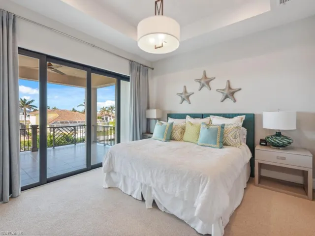 Carpeted bedroom featuring access to exterior