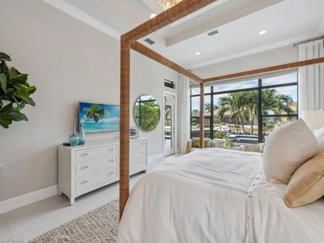 Bedroom featuring access to exterior and light tile patterned floors