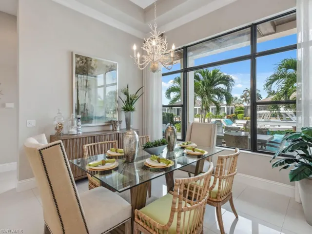 Dining area with a chandelier and light tile patterned floors