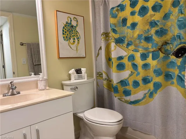 Full bathroom featuring vanity and toilet