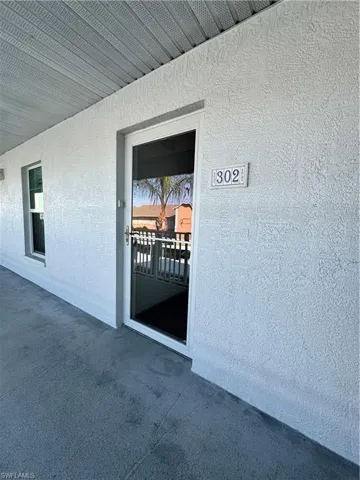 Doorway to property with Storm Smart front door