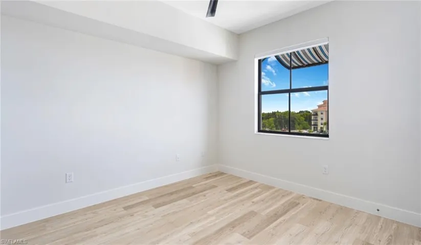 Unfurnished room with light wood-style floors
