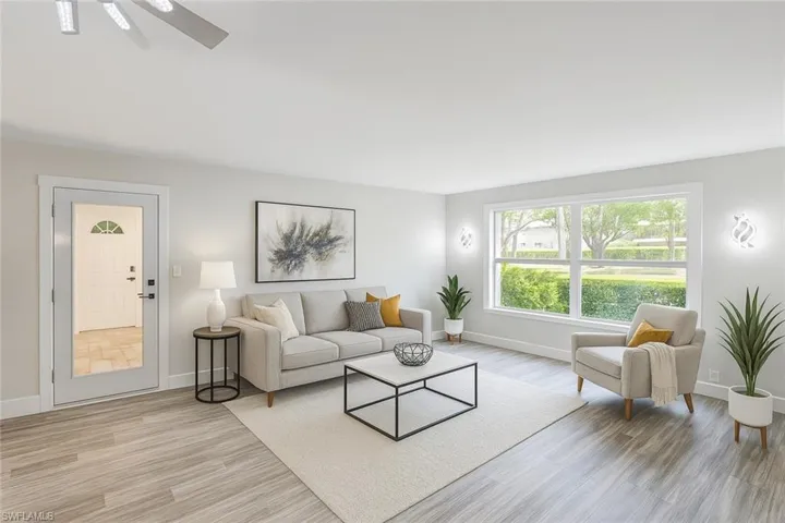 Living area with light wood-type flooring and baseboards