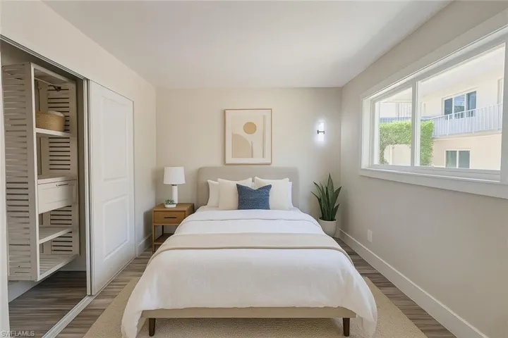 Bedroom with wood finished floors