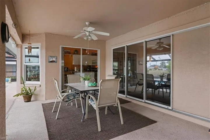 Covered lana with fan and outdoor dining space