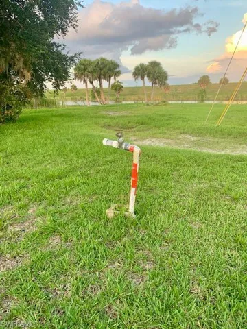 Yard at dusk with a rural view