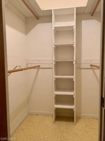 Walk in closet featuring light tile patterned floors