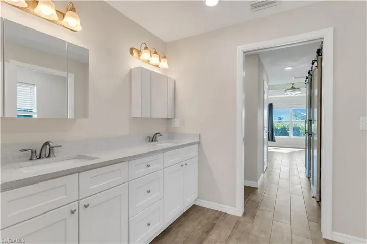 Bathroom featuring vanity and hardwood / wood-style floors