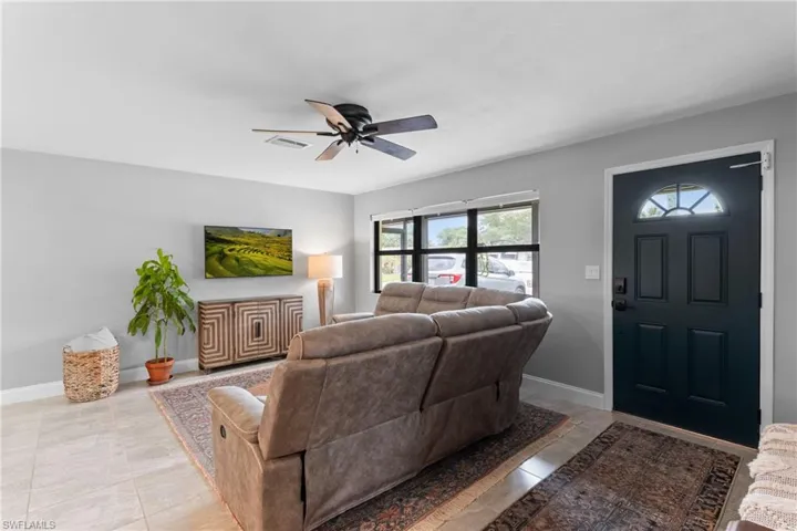 Tiled living room with ceiling fan