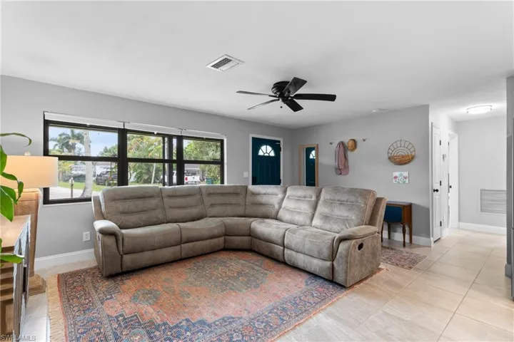 Tiled living room with ceiling fan